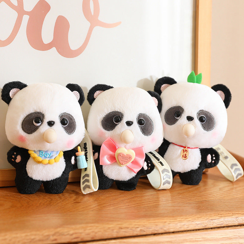 Three panda plush toys with accessories on a wooden surface.