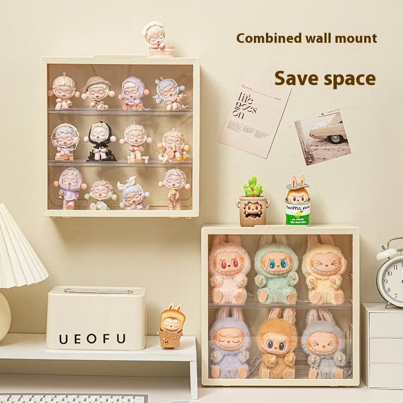 Two wall-mounted shelves with cute figurines and decorative items on a light beige wall.