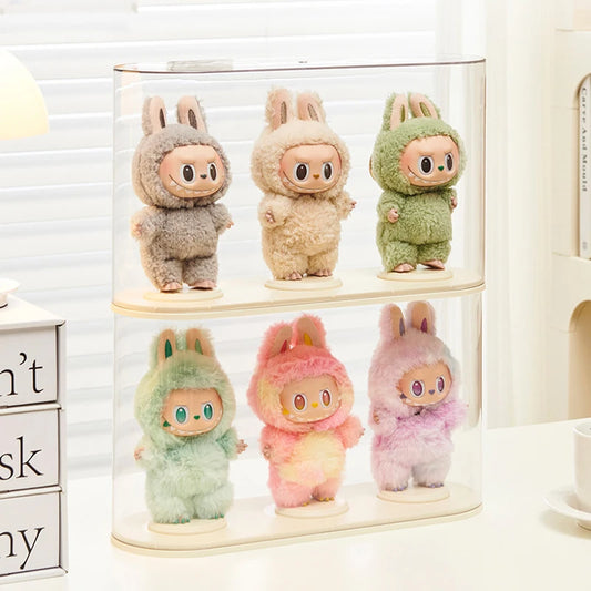 Set of six colorful plush toys in a clear display case on a white surface.