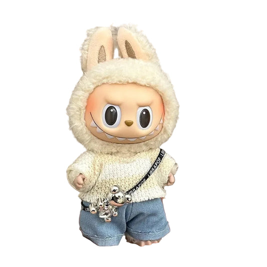 Toy figure of a character in a bunny costume held in a hand against a plain background