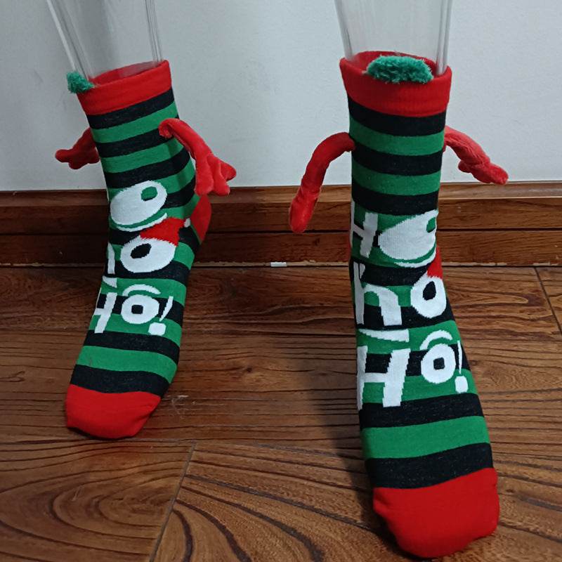 Hand holding Christmas Socks - Goodlifebean