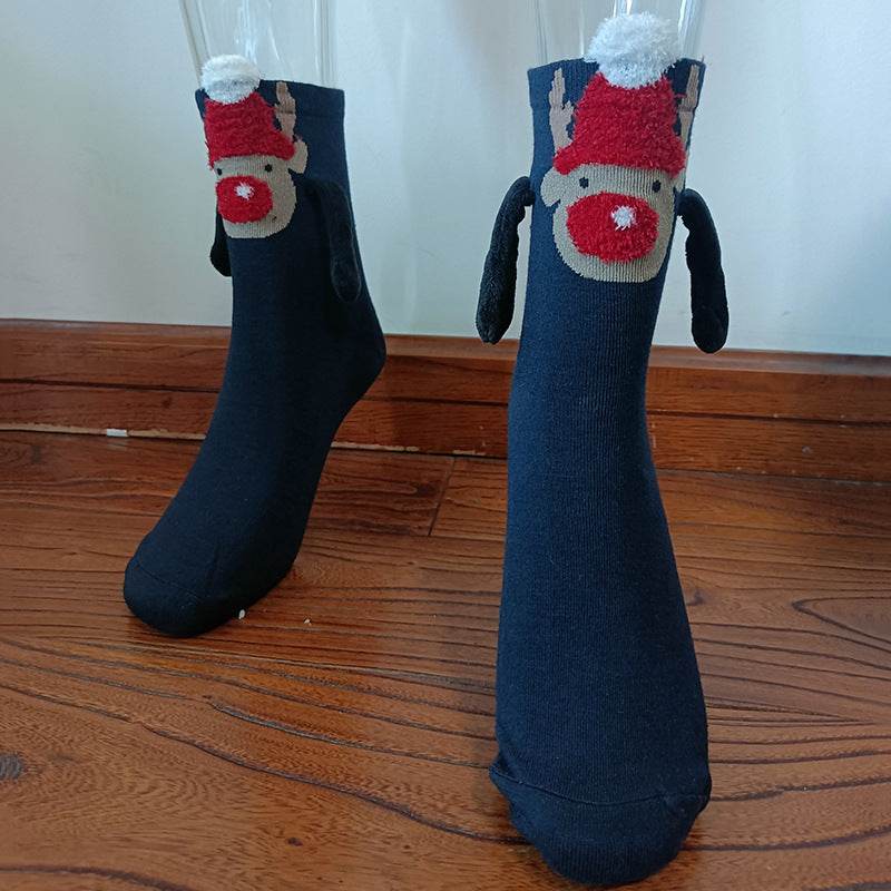 Hand holding Christmas Socks - Goodlifebean