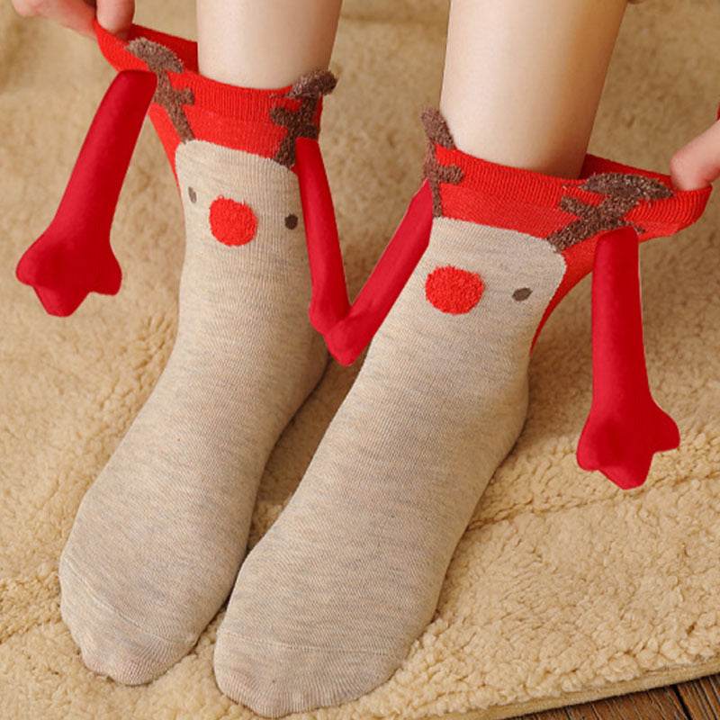 Hand holding Christmas Socks - Goodlifebean