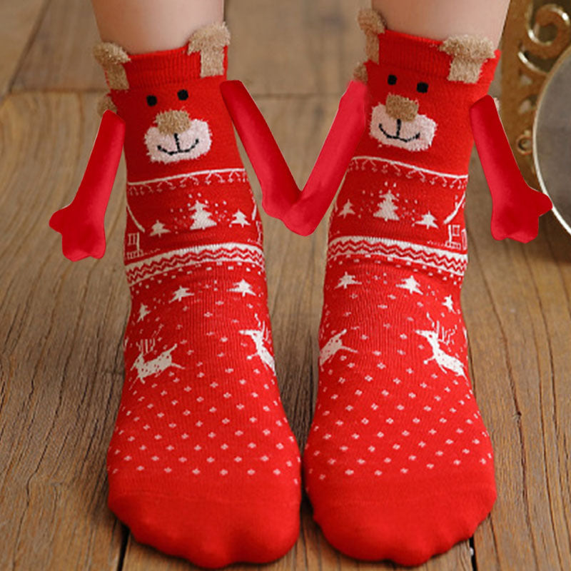 Hand holding Christmas Socks