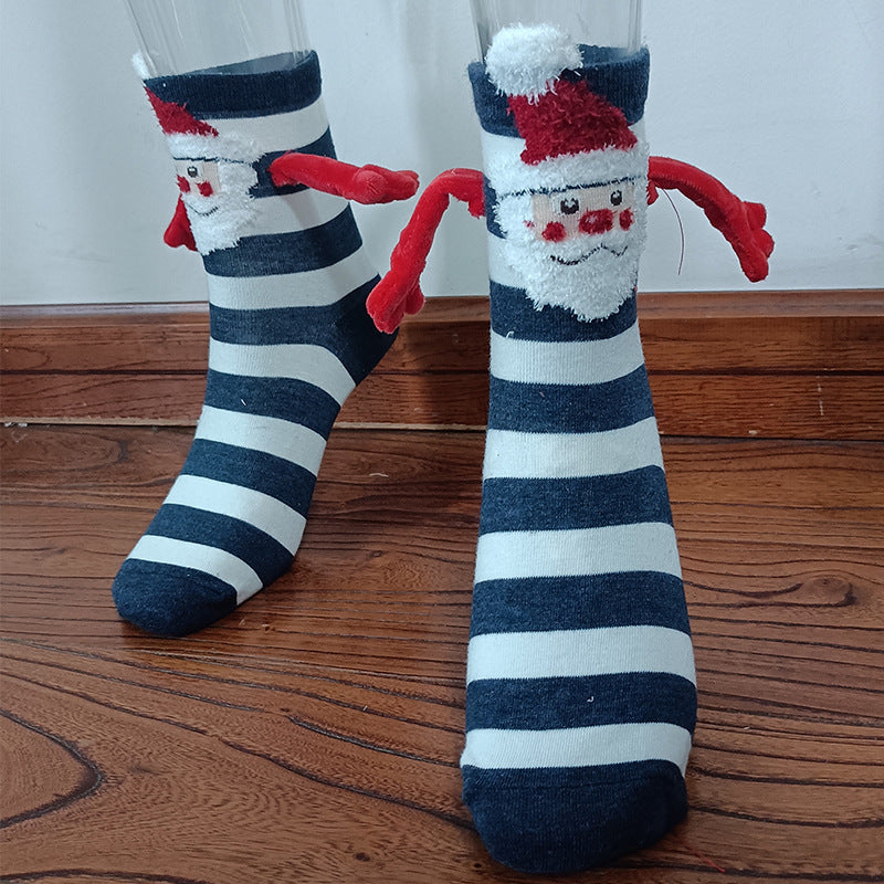 Hand holding Christmas Socks