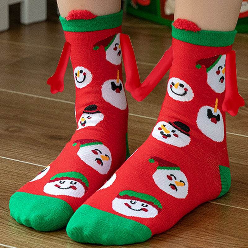 Hand holding Christmas Socks - Goodlifebean