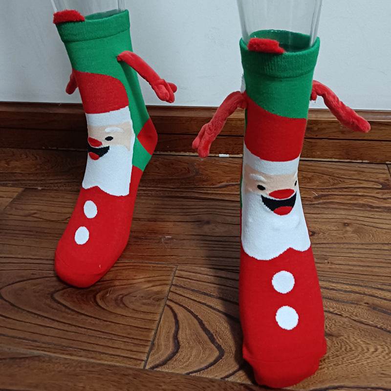 Hand holding Christmas Socks - Goodlifebean