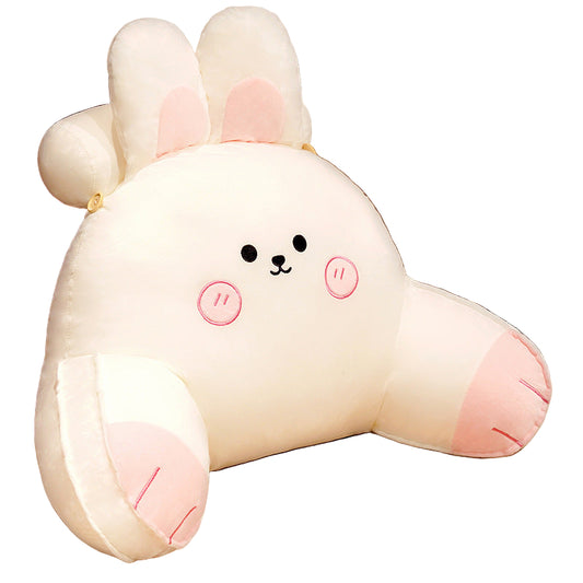 Plush toy shaped like a cartoon character with bunny ears on a table with a LOEWE brand name card.