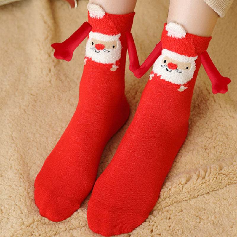 Hand holding Christmas Socks - Goodlifebean