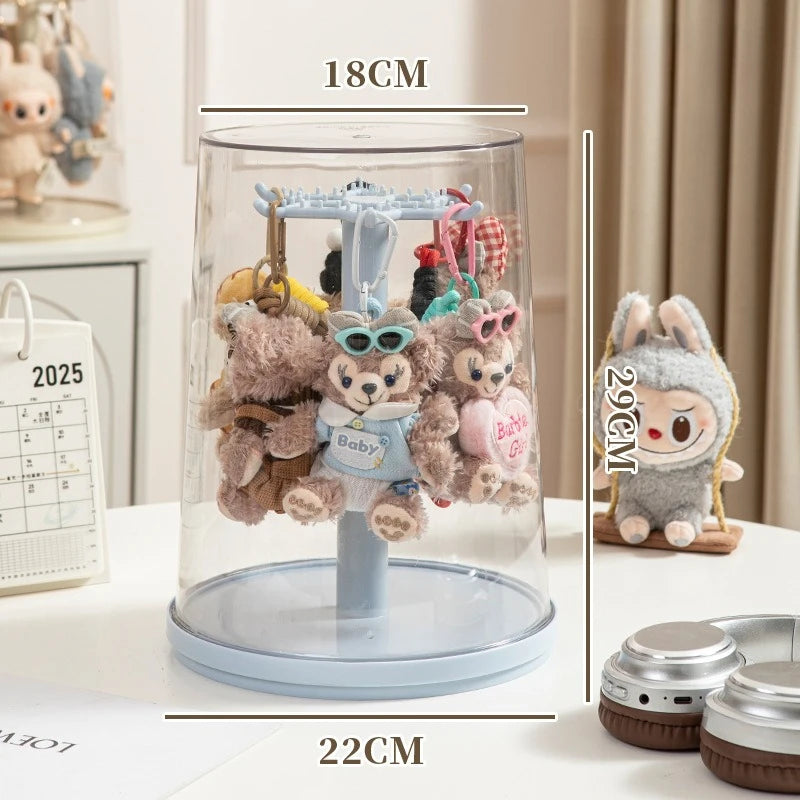 Plush toys on a display stand with measurements and another plush toy on the side.