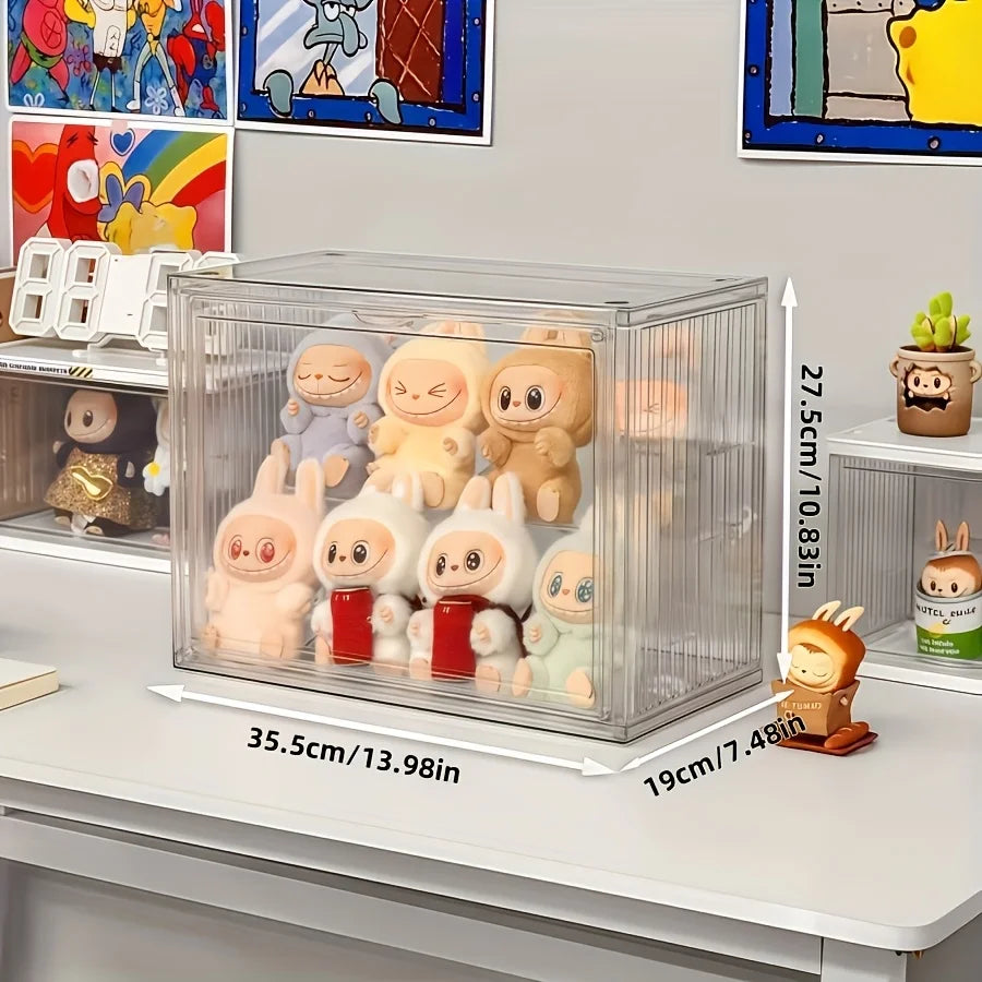 Clear display case with cartoon figurines on a shelf, showing measurements.