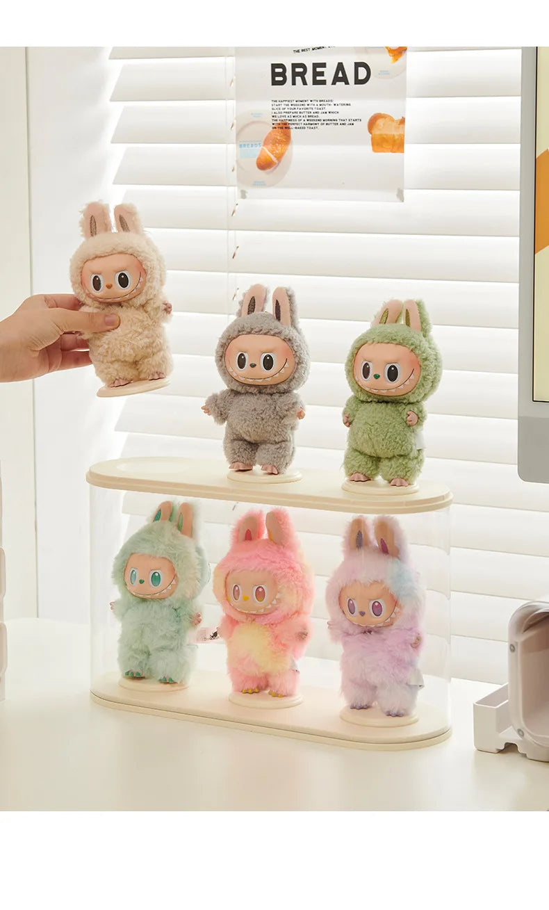 Set of labubu plush toys on a display case .