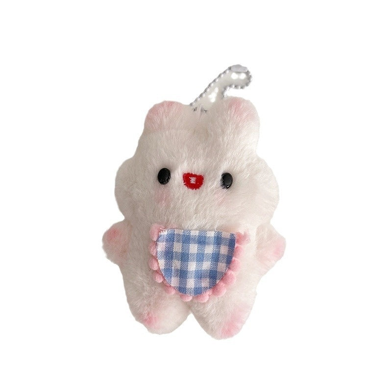 Plush toy with a checkered pocket on a white background