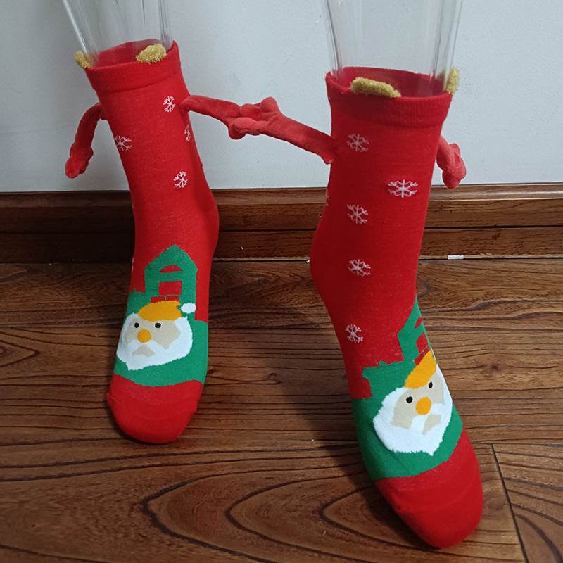 Hand holding Christmas Socks - Goodlifebean