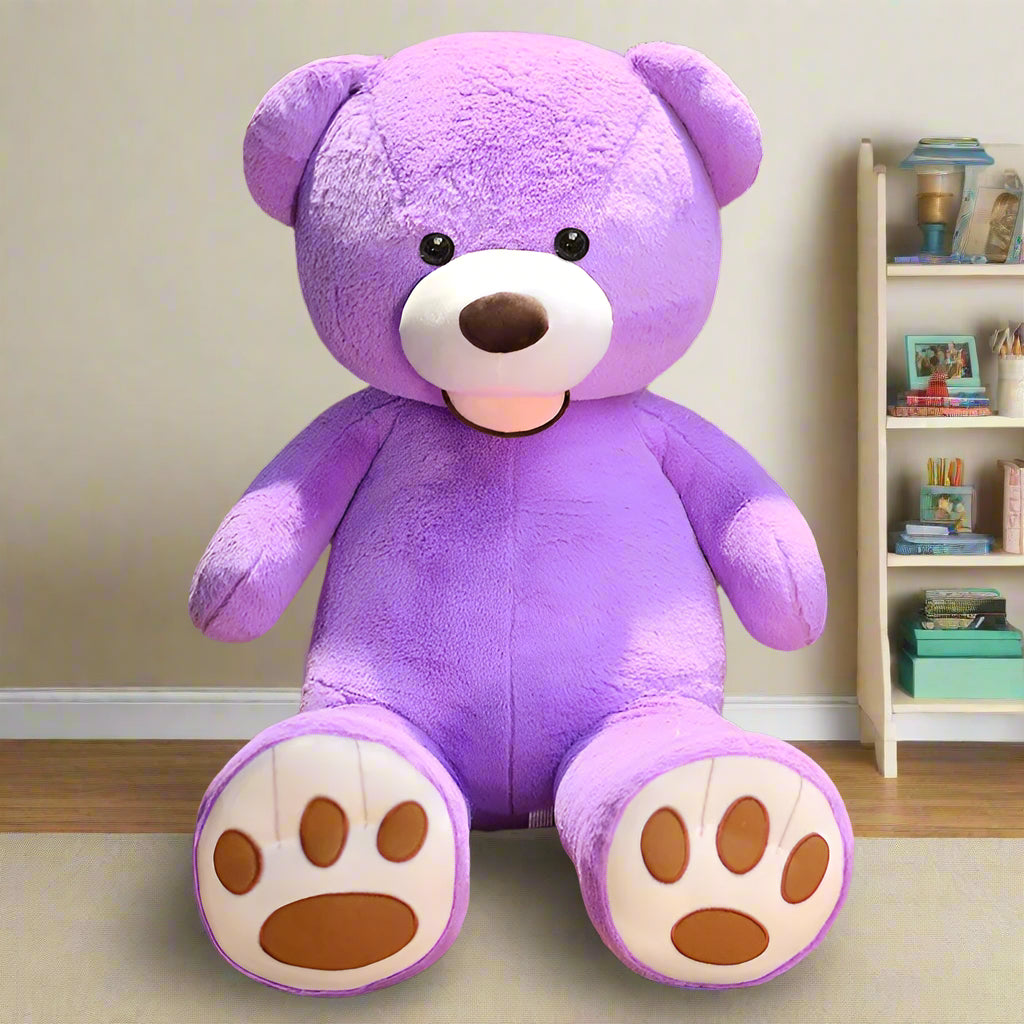 Purple teddy bear on a wooden floor with a bookshelf in the background