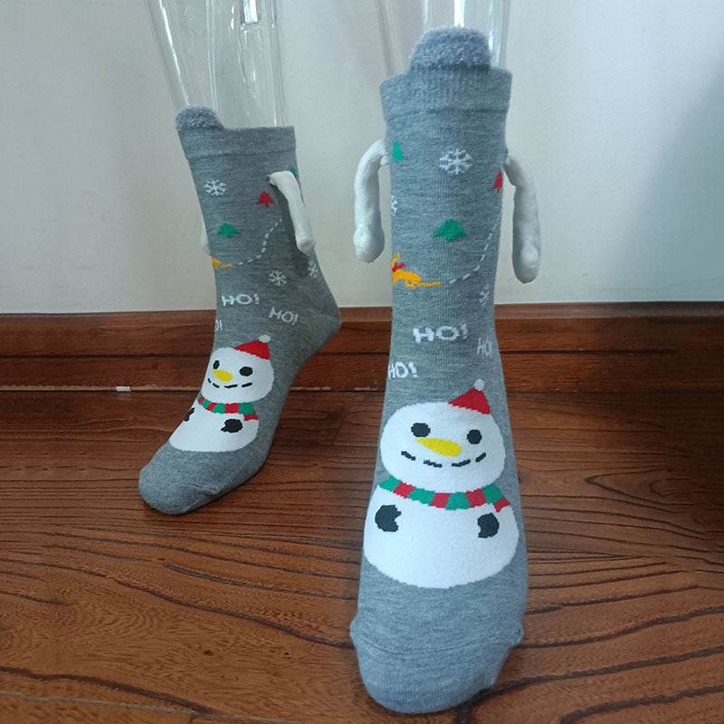 Hand holding Christmas Socks - Goodlifebean