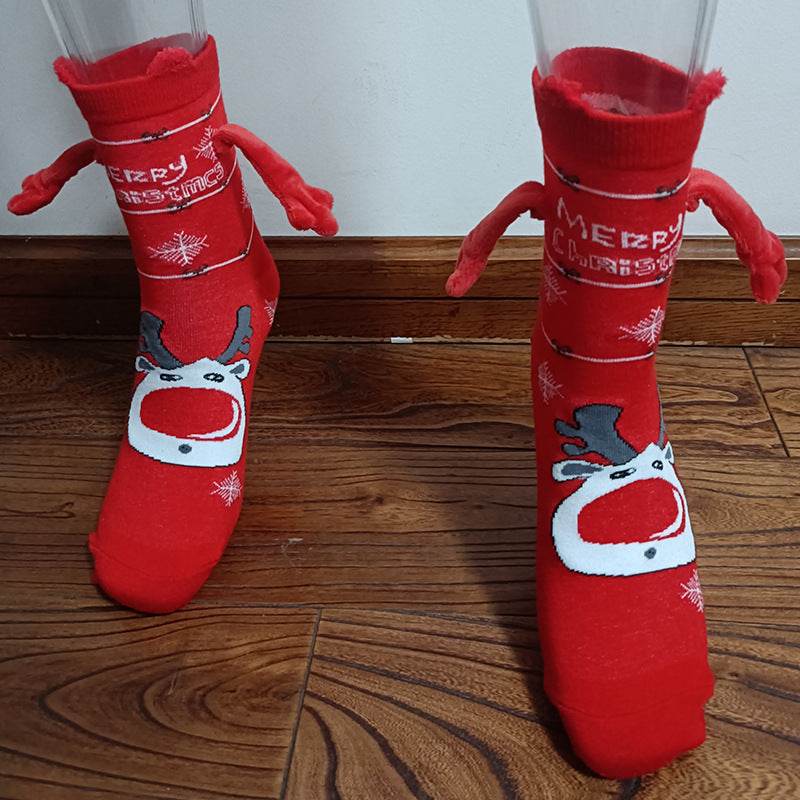 Hand holding Christmas Socks - Goodlifebean